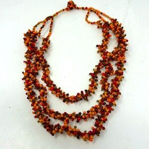 Short handmade stone necklace in orange, brown and red colors
